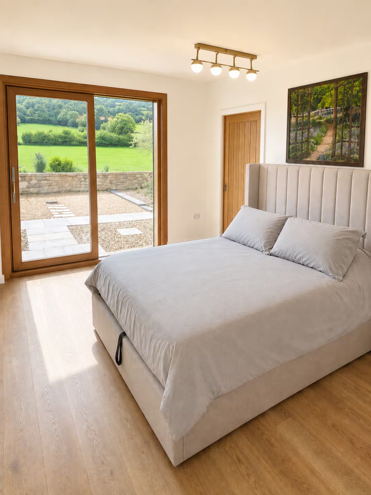 King bedroom with sliding doors onto the garden