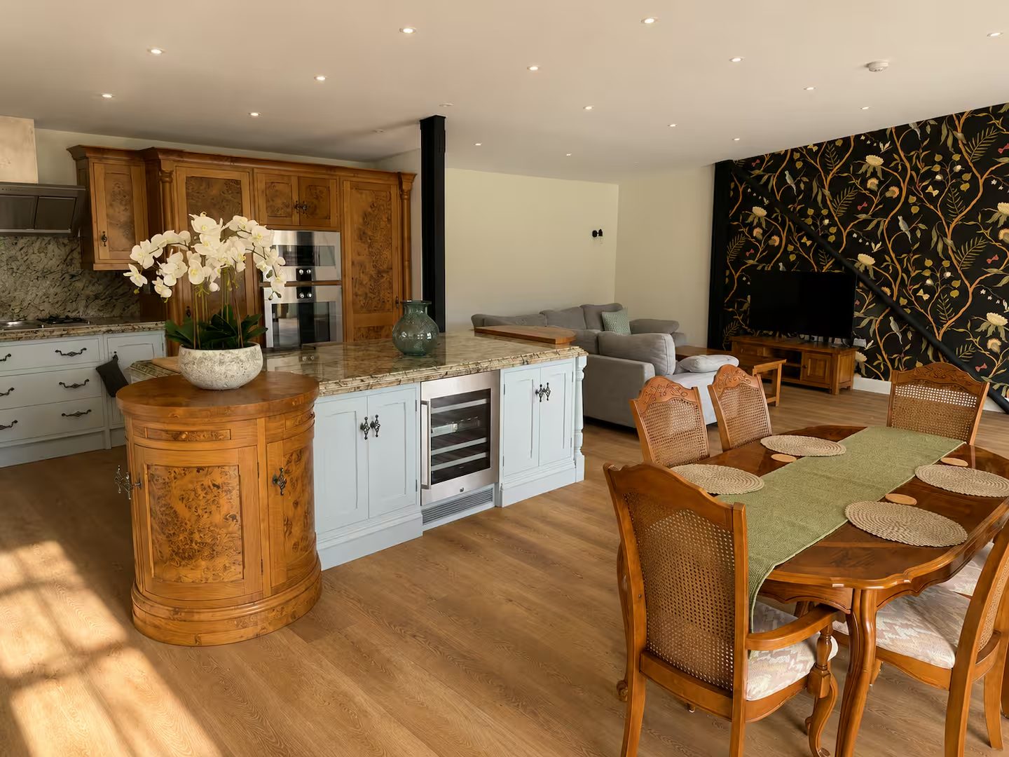 Burr-walnut kitchen with island and dining table