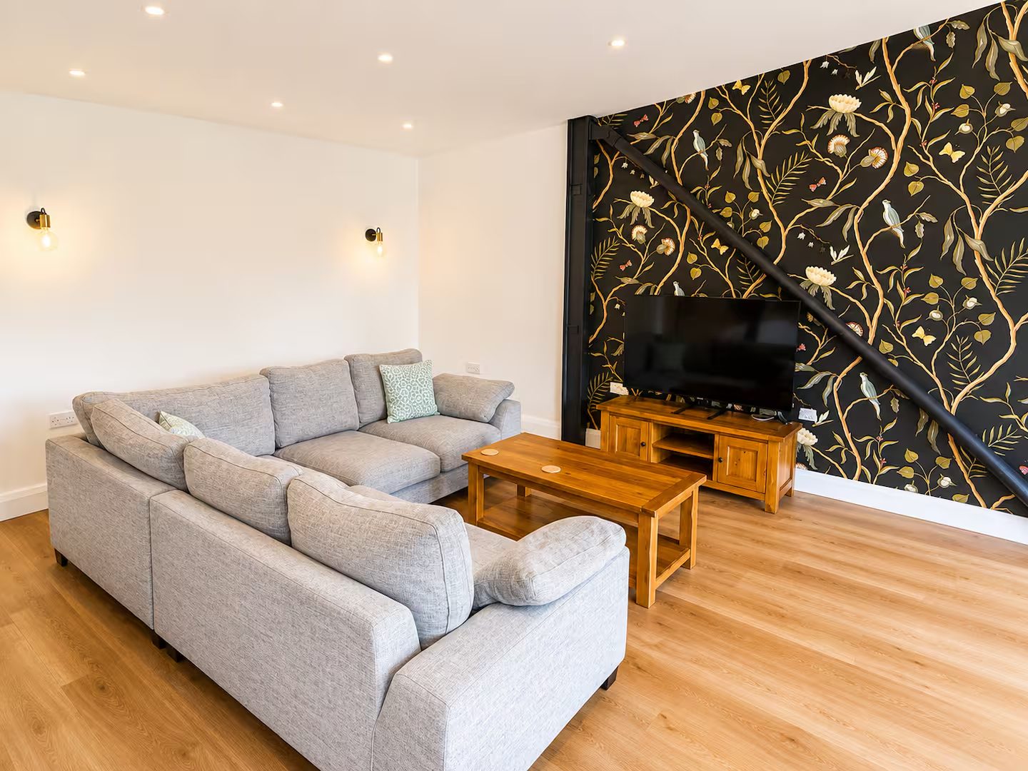 Sitting area with a botanical feature wall